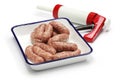 Raw sausage and sausage maker Royalty Free Stock Photo