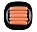 Raw sausages in polyethylene shell in black plate on white