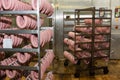 Raw sausages on racks