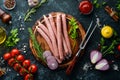 Raw sausages with rosemary and vegetables. Royalty Free Stock Photo