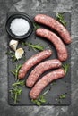 Raw Sausages on Slate Overhead View Royalty Free Stock Photo