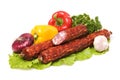 Raw sausages and vegetables Royalty Free Stock Photo