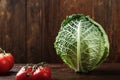Raw savoy cabbage with tomatoes Royalty Free Stock Photo
