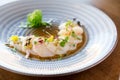 Raw scallops sashimi seafood dish.