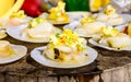 Raw Scallops topped with butter, garlic and parsley.