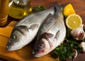 Raw sea bass on cutting board Royalty Free Stock Photo