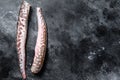 Raw sea eel fish. Black background. Top view. Copy space Royalty Free Stock Photo