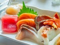 Raw seafood Japanese style, Sashimi, tuna, salmon, octopus, snapper, sea urchin, scallop, and clam, in luxury expensive restaurant Royalty Free Stock Photo