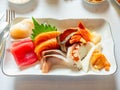 Raw seafood Japanese style, Sashimi, tuna, salmon, octopus, snapper, sea urchin, scallop, and clam, in luxury expensive restaurant Royalty Free Stock Photo