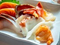 Raw seafood Japanese style, Sashimi, tuna, salmon, octopus, snapper, sea urchin, scallop, and clam, in luxury expensive restaurant Royalty Free Stock Photo