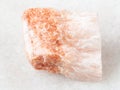 raw Selenite stone on white marble Royalty Free Stock Photo