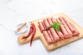 Raw serbian cevapi or cevapcici sausages ready for BBQ Royalty Free Stock Photo
