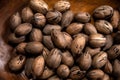 Raw in shell Pecan nuts in a wooden bowl Royalty Free Stock Photo
