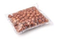 Raw shelled hazelnuts in transparent plastic bag Royalty Free Stock Photo
