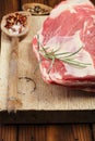 Raw shoulder lamb on wooden board and table Royalty Free Stock Photo