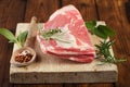 Raw shoulder lamb on wooden board and table Royalty Free Stock Photo