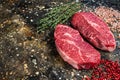 Raw Shoulder Top Blade cuts, beef meat steaks. Brown background. Top View. Copy space Royalty Free Stock Photo