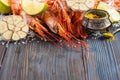 Raw shrimp, garlic, lime, curry and sea salt on a dark wooden background Royalty Free Stock Photo