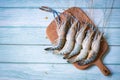 Raw shrimp on wooden cutting board background for cooking food, fresh shrimps prawns seafood shelfish Royalty Free Stock Photo