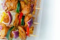 Raw skewers with chicken, zucchini, mushrooms, peppers and onions prepared for grilling Royalty Free Stock Photo