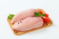 Raw skinless chicken breast fillets