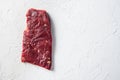 Raw skirt or flank steak,on a white stone background top view space for text Royalty Free Stock Photo