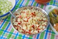 Raw sliced apple for making fruits salad in stainless bowl Royalty Free Stock Photo