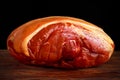 Raw smoked gammon whole bone in. on black board background.