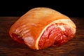 Raw smoked gammon whole bone in. on black board background.