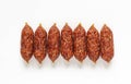 raw smoked mini sausages on a white background Royalty Free Stock Photo