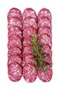 Raw smoked sausage cut into pieces, laid out in rows with rosemary Royalty Free Stock Photo