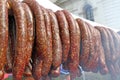 Raw smoked sausages outdoors. Meat baked on the grill bbq. Meat delicacies. Sausages homemade sausages on the grill. Street fo Royalty Free Stock Photo