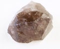 raw smoky quartz ( morion) crystal on white