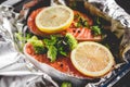 Raw sockeye salmon steaks on foil before baking in oven Royalty Free Stock Photo