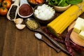 Raw spaghetti Ingredients on wooden table Royalty Free Stock Photo