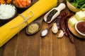 Raw spaghetti Ingredients on wooden table Royalty Free Stock Photo