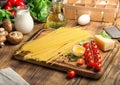 Raw spaghetti with set of ingredients for cooking Italian pasta Royalty Free Stock Photo