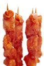 Raw spanish pinchos morunos, spiced chicken meat skewers