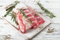 Raw spare ribs with fresh rosemary. Royalty Free Stock Photo