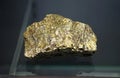 Raw specimen of brass-yellow mineral rock of Chalcopyrite copper iron sulfide mineral stone. Royalty Free Stock Photo