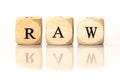 RAW spelled word, dice letters with reflection