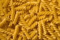 Raw spiral semolina pasta background Royalty Free Stock Photo