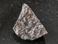 raw spreusteined urtite stone on dark Royalty Free Stock Photo
