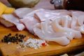 Raw squid composition on a wooden background