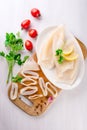 Raw squids and ingredients on the white plate Royalty Free Stock Photo