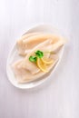 Raw squids and ingredients on the white plate Royalty Free Stock Photo