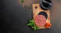 Raw steak cutlets from minced beef meat on a wooden board, Long banner format. top view Royalty Free Stock Photo