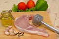 Raw steak with meat hammer and ingredient on wooden board Royalty Free Stock Photo