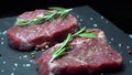 Raw steak with seasonings on a dark background
