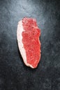 Raw Steak on Slate Background.